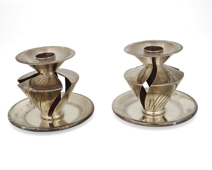 1001
A Pair Of William Spratling Sterling Silver Candlesticks
William Spratling (1900-1967)
Circa 1951-1967, Third Design Period; Taxco, Mexico
Stamped for William Spratling and sterling
Each with three panels of silver and a large drip plate, 2 pieces

Each: 2.875" H x 3.25" Dia.
10.360 oz. troy approximately
Estimate: $500 - $700