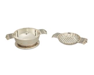 1004
A Willaim Spratling Sterling Silver Tea Strainer Set
William Spratling (1900-1967)
Circa 1931-1946, First Design Period; Taxco, Mexico
Each stamped for William Spratling and sterling
A round tea strainer with tab handles and matching underplate/bowl, both with incised motif and ball decoration, 2 pieces

Bowl: 1.25" H x 4.5"W; strainer: .375" H x 4.125" W
4.620 oz. troy approximately
Estimate: $200 - $400