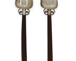 1011
A William Spratling Rosewood Salad Serving Set
William Spratling (1900-1967)
Circa 1951-1967, Third Design Period; Taxco, Mexico
Each stamped for William Spratling and sterling
A rosewood and sterling silver salad serving set comprised of one salad fork and one salad spoon with ball and loop decoration, 2 pieces

Fork: 11.625" L x 2.5" W; spoon: 11.5" L x 2.375" W
5.435 gross oz. troy approximately
Estimate: $400 - $600