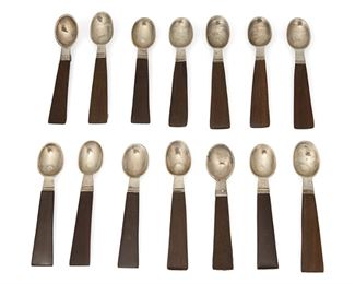 1014
A Set Of William Spratling Rosewood Demitasse Spoons
William Spratling (1900-1976)
Circa 1931-1946, First Design Period; Taxco, Mexico
Each stamped for William Spratling and sterling
Each demitasse spoon with a sterling silver bowl and rosewood handle, 14 pieces

Each: 3.875" L
4.485 gross oz. troy approximately
Estimate: $300 - $500