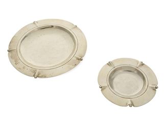 1022
Two William Spratling Sterling Silver Trays
William Spratling (1900-1967)
Circa 1931-1946, First Design Period; Taxco, Mexico
Stamped for William Spratling and sterling
Each graduated, 2 pieces

Largest: 0.375" H x 6.126" Dia.; smallest: 0.25" H x 3.875" Dia.
7.160 oz. troy approximately
Estimate: $200 - $400