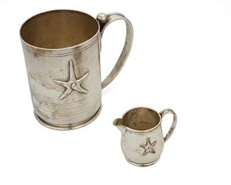1023
Two William Spratling Table Items
William Spratling (1900-1967)
Circa 1951-1967, Third Design Period; Taxco, Mexico
Each stamped for William Spratling; Cream pitcher stamped for Hotel Pierre Marques
Comprising a handled mug with incised lines and applied depiction of the cross section of a Choluteca conch shell together with a small cream pitcher with the same conch shell motif, 2 pieces

Pitcher: 2.125" H x 1.625" Dia.; mug: 4.625" H x 3.5" Dia.
12.735 oz. troy approximately
Estimate: $300 - $500