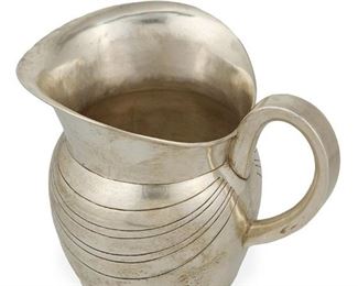 1025
A William Spratling Sterling Silver Martini Pitcher
William Spratling (1900-1967)
Circa 1964-1966, Third Design Period: Taxco, Mexico
Stamped for William Spratling; Further stamped: [Eagle 30]
With enlarged lip, incised swirl design, and hollow handle

4.5" H x 4" W x 4" D
8.545 oz. troy approximately
Estimate: $600 - $900