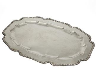 1029
A William Spratling Sterling Silver Serving Tray
William Spratling (1900-1967)
Circa 1931-1946, First Design Period; Taxco, Mexico
Stamped for William Spratling; Further stamped: Spratling Silver
A large silver serving tray with a scalloped, gadrooned edge

0.5" H x 13" W x 20" L
55.425 oz. troy approximately
Estimate: $1,000 - $1,500