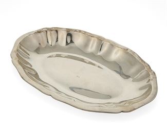 1030
A WIlliam Spratling Sterling Silver Vegetable Server
William Spratling (1900-1967)
Circa 1949-1952, Second Design Period; Taxco, Mexico
Stamped for William Spratling and sterling; Further stamped: [Conquistador's Shield and Eagle 13]
A sterling silver oval-shaped serving bowl with a scalloped edge

1.25" H x 7.875" W x 12.125" D
18.420 oz. troy approximately
Estimate: $300 - $500