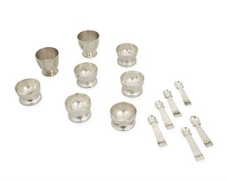 1039
A Group Of William Spratling Sterling Silver Table Items
William Spratling (1900-1967)
Circa 1931-1946 and 1951-1967, First and Third Design Period; Taxco, Mexico
Each stamped William Spratling and sterling; Variously stamped: [Eagle 30]
Comprising five salt dishes with shaped base (1.125" H x 1.75" Dia.), six salt spoons with silver balls (2.375" L), a salt dish on a base with applied silver half circles (1 H x 1.75" Dia.), and two footed cups with silver discs applied (1.625" H x 1.625" Dia.), 14 pieces

11.870 oz. troy approximately
Estimate: $400 - $600