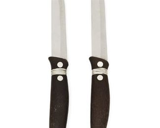 1040
Two William Spratling "Disco" Sterling Silver Steak Knives
William Spratling (1900-1967)
Circa 1951-1956, Third Design Period; Taxco, Mexico
Each stamped for William Spratling and sterling
A near-pair of steak knives with wire wrapped ebony wood handle, carved loop terminal, stainless steel blades, 2 pieces

Each: 9.5" L
2.150 gross oz. troy approximately
Estimate: $400 - $600