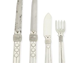 1041
A Group Of William Spratling "Amarres Disco" Sterling Silver Flatware
William Spratling (1900-1967)
Circa 1931-1946 and 1951-1967, First and Third Design Period; Taxco, Mexico
Each stamped for William Spratling and sterling; Three knives further stamped: [Eagle 63]
Comprising two steak knives and a child's knife, all with wire banded shafts with applied flat discs and ball tips referred to as "Heavy Disc Pattern," together with an "Amarres" child's fork, 4 pieces

Each steak knife: 8.5" L; child's fork: 5.215" L; child's knife: 6.125" L
9.150 oz. troy approximately
Estimate: $200 - $300