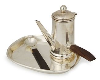 1045
A Group Of William Spratling Sterling Silver Table Items
William Spratling (1900-1967)
Circa 1951-1967, Third Design Period; Taxco, Mexico
Each stamped for William Spratling and sterling; Variously stamped: [Eagle 30]
Comprising a chocolate/bachelors coffee pot (6.25" H), a silver tray (0.75" H x 8.75" W x 6.75" D), and a rosewood spoon (6.375" L), 3 pieces

31.055 gross oz. troy approximately
Estimate: $800 - $1,200