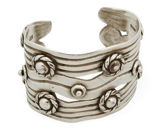 1050
A William Spratling "River Of Life" Silver Cuff Bracelet
William Spratling (1900-1967)
Circa 1933-1939, First Design Period; Taxco, Mexico
Stamped for William Spratling; Further stamped: Taxco / Mexico / 980
A sterling "River of Life" cuff with applied rope design rounds

6.75" total inner C x 2" H, including a 1.125" gap
128.7 grams
Estimate: $1,000 - $1,500