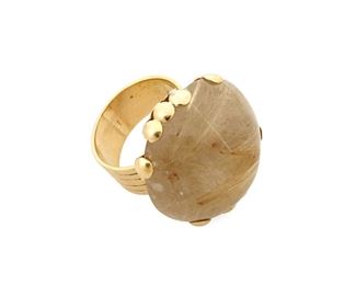 1061
A William Spratling 18k Gold And Rutilated Quartz Ring
William Spratling (1900-1967)
Circa 1951-1967, Third Design Period; Taxco, Mexico
Stamped for William Spratling; Further stamped: 18K
Comprising an incised gold band with claw-set rutilated quartz cabochon and gold ball terminal accents

Ring Size: 5.5; 1" Dia.
15.0 grams gross
Estimate: $1,000 - $2,000