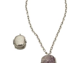 1076
Two William Spratling Box Pendants
William Spratling (1900-1967)
Circa 1939 and 1940-1944, First Design Period; Taxco, Mexico
Each stamped for William Spratling; Variously stamped: Taxco / Mexico / [obscured] 980 / Spratling of Mexico / Silson Inc.; Chain stamped: Germany
Comprising two pendant pill boxes, including a sterling silver pill box with set amethyst cabochons to each side with attached chain, and a silver-plated Silson pill box with rope trim, 2 pieces

Largest box: 2" H x 1.375" W x 1.375" D; Chain: 20.5 " L
162.1 grams gross
Estimate: $600 - $800