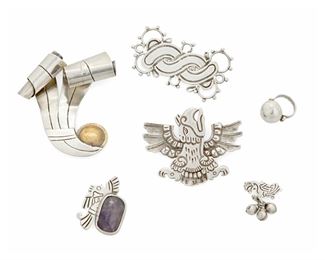 1084
A Group Of William Spratling Silver Jewelry
William Spratling (1900-1967)
Circa 1933-1938,1940-1944, and 1944-1946; First Design Period; Taxco, Mexico
Each stamped for William Spratling; Variously stamped: Made in Mexico / Spratling Silver / Sterling
Comprising five brooches of various designs and sizes, including a sterling chased silver and repousse eagle (2.5" H x 2" W), a silver ribbon brooch with copper disc accent (3" H x 2.625" W), a small chased silver bird pin with rectangular amethyst cabochon (1" H x 1.5" W), as well as a sterling domed ring (Ring size: 3.5), 6 pieces

100.6 grams gross
Estimate: $600 - $900