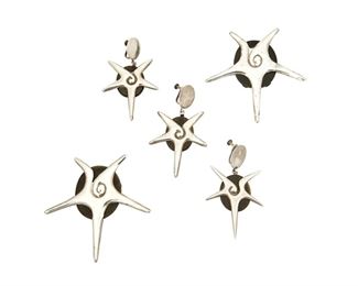 1100
A Group Of William Spratling "Choluteca" Silver And Obsidian Jewelry
William Spratling (1900-1967)
Circa 1964-1967, Third Design Period; Taxco, Mexico
Each stamped for William Spratling; Further variously stamped: .925 / Taxco Mexico / [Eagle 63] / [Eagle 30]
Comprising two starfish brooches, a pair of matching earrings and a single matching earring, 5 pieces

Each brooch: 3" H x 3" W; Each earring: 2.75" H x 1.75" W approximately
72.5 grams gross
Estimate: $800 - $1,200