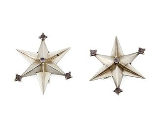 1101
Two William Spratling Silver And Amethyst Star Brooches
William Spratling (1900-1967)
Circa 1940-1944, First Design Period; Taxco, Mexico
Each stamped for William Spratling; Further stamped: Made in Mexico / Spratling Silver [in oval]
Each brooch/clip fastener designed as a six-pointed star with four set amethyst cabochons and a double-pronged clip backing, 2 pieces

Each approximately: 2" H x 1.75" W
24.4 grams gross
Estimate: $500 - $700