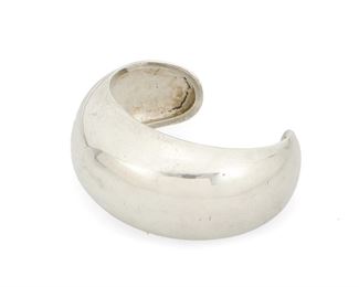 1110
An Antonio Pineda Silver Cuff Bracelet
Antonio Pineda (1919-2009)
Circa 1953-1980; Taxco, Mexico
Crown mark for Antonio Pineda; Further stamped: Hecho in Mexico / Silver / 970 / [Eagle 17] / ZZ661
A hammered domed silver cuff with tapered terminals

6.5" total inner C x 1.25" H, with a 1.25" gap
57.2 grams
Estimate: $300 - $500
