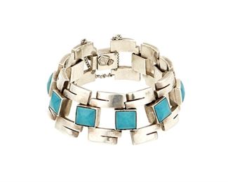 1115
An Antonio Pineda Silver And Turquoise Bracelet
Antonio Pineda (1919-2009)
Circa 1953-1979; Taxco, Mexico
Crown mark for Antonio Pineda and Eagle 121
Comprising a sterling geometric open link bracelet with square set cut turquoise spacers

6.75" L x 1" H
91.8 grams gross
Estimate: $800 - $1,200