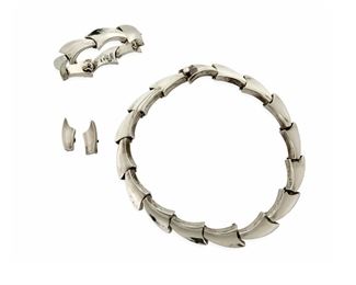 1118
A Group Of Antonio Pineda Silver Jewelry
Antonio Pineda (1919-2009)
Circa 1953-1979; Taxco, Mexico
Crown mark for Antonio Pineda and Eagle 17; Each variously stamped: Hecho en Mexico / Silver / 970
Comprising a matching link necklace, link bracelet and earclips designed with chunky, concave stylized wing links, 4 pieces

Necklace: 17" L x 0.75" H; Bracelet: 7" L x 0.75" H; Each earclip: 1" H
271.2 grams
271.2 grams
Estimate: $1,000 - $2,000