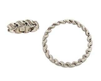 1120
A Set Of Antonio Pineda Silver Jewelry
Antonio Pineda (1919-2009)
Circa 1953-1979; Taxco, Mexico
Crown mark for Antonio Pineda and Eagle 17; Each variously stamped: Hecho en Mexico / 970 / ZZ777 / JFL / YY641
A silver necklace and bracelet each comprised of stylized wave abstract links, 2 pieces

Necklace: 16.25" L x 0.625" H; Bracelet: 7.5" L x 0.875" H
175.5 grams
Estimate: $1,000 - $2,000