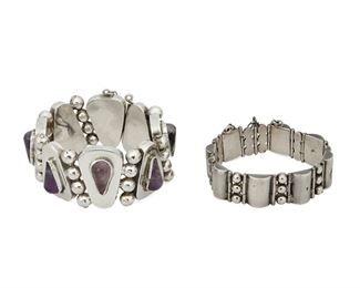1136
Two Antonio Pineda Silver And Amethyst Bracelets
Antonio Pineda (1919-2009)
Circa 1948-1953; Taxco, Mexico
Each stamped: Silver by Tono; Further stamped: Mexico
Comprising a link bracelet with pear shaped amethyst (8" L x 1.25" H) and a half cylindrical link bracelet (7" L x 0.625" H), 2 pieces

149.1 grams gross
Estimate: $1,200 - $1,800