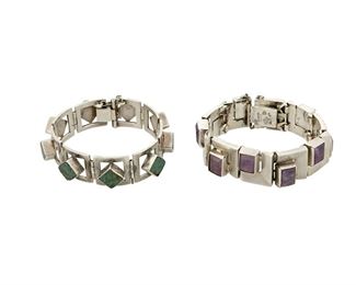 1148
Two Antonio Pineda Silver And Stone Bracelets
Antonio Pineda (1919-2009)
Circa 1953-1979; Taxco, Mexico
Crown mark for Antonio Pineda; Each variously stamped: [Eagle 17] / Hecho en Mexico / 970 / Silver
Comprising two bracelets with geometric links; one set with faceted amethyst and one with diamond shaped green stone, each with a chain guard, 2 pieces

Each: 7" L x 0.75" H
175.8 grams gross
Estimate: $1,200 - $1,800