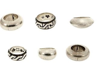 1159
A Group Of Antonio Pineda Silver Jewelry
Antonio Pineda (1919-2009)
Circa 1953-1979; Taxco, Mexico
Crown mark for Antonio Pineda; Each variously stamped: [Eagle 208] / [Eagle 58] / JVL Taxco / 925 / Silver / 970; Earrings attributed to Pineda
Comprising two domed silver rings, two rings with geometric silver overlay motifs, and one pair of thick hoop clip earrings, 6 pieces

Largest ring size: 10; smallest: 7; Each earring: 1.125" Dia.
74.3 grams
Estimate: $500 - $700