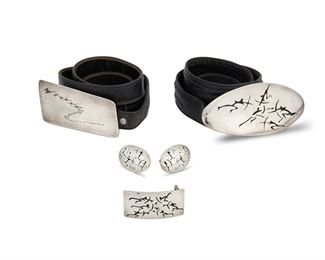 1160
A Group Of Antonio Pineda Lascaux-Motif Silver Jewelry
Antonio Pineda (1919-2009)
Circa 1953-1979; Taxco, Mexico
Each with crown mark for Antonio Pineda and 970
Four works:

A mixed-metal buckle with a flock of birds motif on a black leather belt
Further stamped: [Eagle 17] / Hecho en Mexico / Silver
Buckle: 2" H x 5" L; Belt: 31" L

A large shadowbox-style Lascaux-motif oval belt buckle on a black leather belt
Further stamped: [Eagle 17] / Hecho en Mexico / Silver / PZ148
2.375" H x 5.75" W; Belt: 32" L

A shadowbox Lascaux-motif rectangular buckle
Further stamped: [Eagle 17] / Hecho en Mexico / Silver / PZ155
1.125" H x 2.25" W

A pair of oval Lascaux-motif cufflinks
Further stamped: [Eagle 3] / VJ / Taxco / Mexico
Each: 1" H x 1.5" W

5 pieces
424.3 grams gross
Estimate: $800 - $1,200