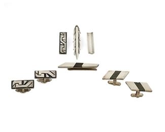 1164
A Group Of Antonio Pineda Silver Accessories
Antonio Pineda (1919-2009)
Circa 1953-1979; Taxco, Mexico
Crown mark for Antonio Pineda; Variously stamped: [Eagle 17] / [Eagle 3] / Hecho en Mexico / 970 / JVL / Taxco / Silver
Comprising two silver tie clips (2" H and 1.25" H), an obsidian inlay money clip (2.25" H), a pair of silver cufflinks with geometric overlay (1.125" H) and a matching tie clip (1.25" H), and a pair of hardstone inlay cufflinks (1.25" H), 8 pieces

87.5 grams gross
Estimate: $500 - $700