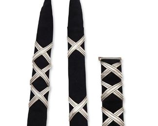 1172
Two Hector Aguilar Silver Concho Items
Hector Aguilar (1905-1986)
Circa 1940-1945 and 1948-1962; Taxco, Mexico
Each buckle stamped HA; Further variously stamped: Sterling / Made in Mexico / .940 / Taxco / Mexico / Taller Borda / [Eagle 9]
Comprised of a black suede bracelet with three X-form conchos and a silver clasp buckle, together with a belt with five X-form conchos set to black fabric, with a silver clasp buckle, 2 pieces

Bracelet: 7" L x 1.625" H; Each concho: 1.75" H x 2" W; Belt: 32" L x 1.375" H; Each concho: 1.25" H x 2.125" W
204.0 grams gross

Estimate: $1,000 - $1,500