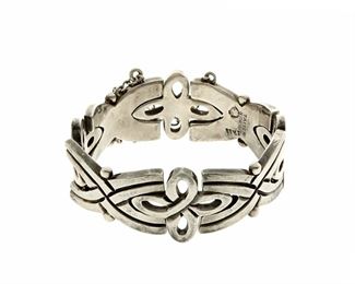 1177
A Hector Aguilar Sterling Silver Bracelet
Hector Aguilar (1905-1986)
Circa 1948-1962; Taxco, Mexico
Stamped: HA / Taxco / Mexico / .940 / Taller Borda / [indistinct eagle]
A silver link bracelet with stylized "X" and quatrefoil links, with pin closure

6.75" L x 1" H
94.7 grams
Estimate: $700 - $900