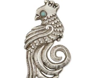 1191
A Matl Silver Bird Brooch
Matilde Poulat (c. 1900-d. 1960)
Circa 1934-1948; Mexico City, Mexico
Stamped: Matl
Designed by Matilde Poulat, comprising a repousse bird brooch with turquoise eye and silver backing

4" H x 2.75" W
37.3 grams gross
Estimate: $400 - $600