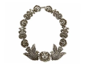 1193
A Matl Silver Necklace
Matilde Poulat (c. 1900-d. 1960)
Circa 1934-1948; Mexico City, Mexico
Signed to plaque: Matl
Designed by Matilde Poulat, an elaborate silver repousse link necklace with bird and roses motifs

19" L x 2" H
188.0 grams
Estimate: $2,000 - $3,000