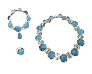 1202
A Mixed Group Of Los Castillo Jewelry
Circa 1940-1965; Taxco, Mexico
Two stamped: Los Castillo; Variously stamped: Taxco / Hecho en Mexico / [Eagle 15]; Ring stamped: Sterling / ___eca [likely partial Azteca]
Comprising a collar necklace formed of graduated links of set blue glass cabochons alternating with silver rectangular links with applied silver balls (15.25" L x 1" H), a matching blue glass and silver ring (Ring size: 6.25), and a similar style link bracelet of blue glass cabochons and silver ball spacers with a glass teardrop dangle (7.25" L x 2" H), 3 pieces
221.5 grams gross
Estimate: $500 - $700