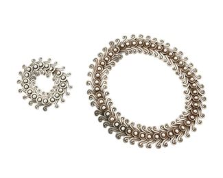 1204
A Set Of Los Castillo Sterling Silver Jewelry
Circa 1940-1945; Taxco, Mexico
Necklace stamped: Los Castillo / Taxco / Sterling / Made in Mexico / 263; Bracelet appears unmarked
Comprising a link necklace and an associated smaller scale bracelet in stylized curls with ball joints, each with hook and eye closures
Necklace: 17.5 L x 1.25" H; Bracelet: 7" L x 1.125" H
283.4 grams
Estimate: $800 - $1,200