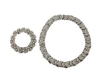 1205
A Suite Of Los Castillo Sterling Silver Jewelry
Circa 1940-1945; Taxco, Mexico
Each stamped: Los Castillo / Taxco / Sterling / Made in Mexico / [design number]
Comprised of an incised geometric link necklace No. 261 and bracelet No. 652, 2 pieces
<br /> Necklace: 16.25" L x 0.75" H; Bracelet: 7" L x 0.625" H
158.1 grams
Estimate: $800 - $1,200