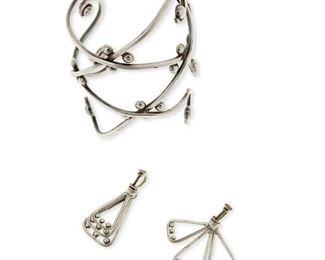 1208
A Group Of Mexican Silver Jewelry
Two works:

A Los Castillo large filigree wire cuff bracelet
Circa 1950-1965; Taxco, Mexico
Stamped: Los Castillo / Taxco / Sterling / Made in Mexico / [Eagle 15] / 649
7" total inner C x 4" H, including a 1.5" gap

A pair of Reveriano Castillo silver wire earrings
Reveriano Castillo (b. 20th century)
Circa 1952-1980; Taxco, Mexico
Stamped: R [within] C / Taxco / Sterling / Mexico / 98
Each earring: 1.75" H

3 pieces
86.9 grams
Estimate: $300 - $500