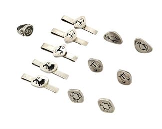 1212
A Group Of Los Castillo Silver Astrological Items
Circa 1948-1955 and 1950-1965; Taxco, Mexico
Each stamped: Los Castillo / Taxco; Variously stamped: Sterling / 925 / Made in Mexico / [Eagle 15] / [Design number]; Ring stamped: Mosaico Azteca
Comprising nine works, each with a shadowbox Zodiac figure, including three pair of earrings with motifs of Cancer, Aquarius, and Libra (146) and five silver money clips, with three of Capricorn and two of Leo (Four: 185; one: 146), as well as a silver and hardstone inlay ring with a Cancer sign (114), 12 pieces
Largest earring: 1.125" H; Largest clip: 1" H x 2.375" W; Ring size: 5.75
125.0 grams gross
Estimate: $300 - $500