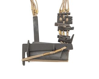 1218
A Fernando Calderon Black Ceramic Necklace
Fernando Calderon (b. 1959)
Late 20th century; Lima, Peru
Signed to reverse: Calderon / Lima / Peru
Formed of black matte glazed ceramic pieces of various shapes and sizes joined with and suspended from narrow braided beige cordage, interspersed and finished with brass aglets

35" L x 2.25" H
Estimate: $600 - $800