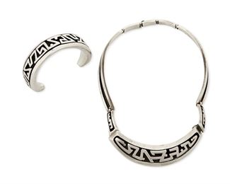 1224
A Set Of Salvador Teran Sterling Silver Jewelry
Salvador Teran (c. 1920-d. 1974)
Circa 1955-1970; Mexico City, Mexico
Each stamped: Salvador / Sterling / Mexico / [Eagle 36] / 165
Comprising a geometric shadowbox link collar necklace and matching cuff bracelet, No. 165, 2 pieces

Necklace: 16" L x 0.875" H; Cuff: 6" total inner C x 0.875" H, including a 1.625" gap
109.7 grams
Estimate: $400 - $600