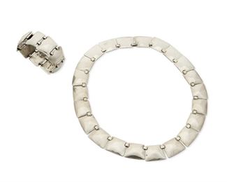 1229
A Set Of Abraham Paz Sterling Silver Jewelry
Abraham Paz (b. 20th century)
Circa 1940-1950; Mexico City, Mexico
Each stamped: A. Paz / 0.925; Necklace further stamped: Hecho en Mexico
Comprised of a link necklace and matching bracelet designed with trapezoidal links, 2 pieces

Necklace: 17" L x 0.75" H; Bracelet: 6.75" L x 0.875" H
94.7 grams
Estimate: $500 - $700