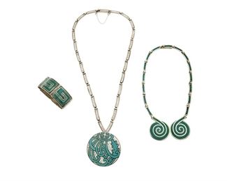 1238
A Group Of Margot De Taxco Silver And Enamel Jewelry
Margot Van Voorhies (1896-1985)
Circa 1955-1978; Taxco, Mexico
Each stamped: Margot de Taxco / Made in Mexico / Sterling / [Eagle 16] / [Design number]
Comprising a teal enamel "Square Scroll" hinged bracelet No. 5376 (6.5" L x 1" H), a turquoise and white melange "Mum in Circle" pendant/brooch with detachable chain No. 5842 (23.5" L x 2.325" Dia.) and a teal "Circular Spiral" bib necklace No. 5357 (16" L x 1.75" H), 3 pieces

207.5 grams gross
Estimate: $800 - $1,200