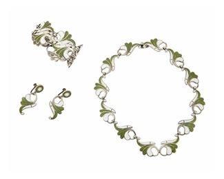 1244
A Suite Of Margot De Taxco Silver And Enamel Jewelry
Margot Van Voorhies (1896-1985)
Circa 1955-1978; Taxco, Mexico
Each stamped: Margot de Taxco / Made in Mexico / Sterling / [Eagle 16] / 5626
Designed by Margot Van Voorhies in the "Small Curled Leaf" design with stylized leaves in green and white enamel, comprising a link necklace, a double-width link bracelet, and a pair of screw-back earrings, 4 pieces

Necklace: 15.5" L x 1" H; Bracelet: 6.75" L x 1.25" H; Each earring: 1.75" H
136.6 grams gross
Estimate: $800 - $1,200
