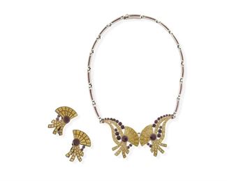 1245
A Set Of Margot De Taxco Silver And Enamel Jewelry
Margot Van Voorhies (1896-1985)
Circa 1955-1978; Taxco, Mexico
Each stamped: Margot de Taxco / Sterling / Made in Mexico / [Eagle 16] / [Design number]
Comprised of a purple and yellow enamel bib link necklace with matching earclips, each No. 5618, 3 pieces

Necklace: 15" L x 1.25" H; Each earring: 1.25" H
55.5 grams gross
Estimate: $500 - $700