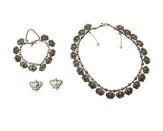 1247
A Group Of Margot De Taxco Sterling Silver Jewelry
Margot Van Voorhies (1896-1985)
Circa 1948-1978; Taxco, Mexico
Three stamped: Margot de Taxco / Sterling / Made in Mexico / [Eagle 16] / [Design number]; Bracelet stamped: 5183
Comprising a crown necklace (14.5" L) with matching bracelet (6.5" L), each No. 5183; and a pair of earclips No. 5129 (0.75" H), 4 pieces

82.8 grams
Estimate: $300 - $500