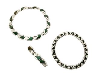 1266
A Group Of Enrique Ledesma Silver And Hardstone Jewelry
Enrique Ledesma (d. 1979)
Circa 1955-1979; Taxco, Mexico
Each stamped for Ledesma and silver; Two further stamped: Platera Cortés / Hecho en Mexico / [Eagle 3] / 925 / Taxco / [Design number]; one further stamped: Mexico
Comprised of a Platera Cortes silver and stylized azurmalachite inlay flower link necklace No. 201 (16" L x 0.75") and matching bracelet No. 202 (7" L x 0.75" H), as well as a silver trapezoidal link necklace with azurmalachite inlay (13.5" l x 0.5" H), 3 pieces

158.9 grams gross
Estimate: $600 - $800