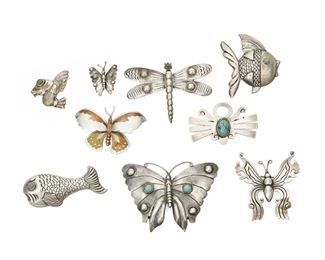 1270
A Group Of Figurative Mexican Silver Brooches
Mid/Late 20th century
Each marked for silver and Mexico or Taxco; Variously marked: Victoria / Metales / Cony / 214 / Anton / Plata / Juarez / SM
Comprised of various pins and brooches including an Anton silver and turquoise fish; A Juarez silver and turquoise butterfly; a Victoria mixed metal butterfly; a silver dragonfly with turquoise eyes; a miniature silver butterfly; a tall, narrow incised silver butterfly; a silver fish with a green stone eye; a larger fish with turquoise eye; and a stylized insect pin with central turquoise cabochon, 9 pieces
Largest: 2.5" H x 3.25" W
121.1 grams gross
Estimate: $400 - $600