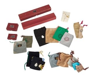 1281
A Group Of Original Taxco Silver Retail Packaging
Mid-20th century; Taxco, Mexico
Various Taxco artisan labels
A group of sterling silver retail packaging comprising of fabric bags and cardboard boxes with original stickers/stamped logos; including six bags labeled William Spratling, four bags labeled Margot de Taxco and two bags labeled Antonio Pineda; as well as original boxes from Hector Aguilar (Taller Borda) and Antonio Pineda, 23 pieces
Largest fabric bag: 7.25" L x 5.5" W; smallest fabric bag: 2.75" L x 2" W
Estimate: $300 - $500