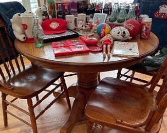Round oak table & 4 pressed back chairs