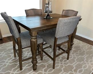 Like new Table and 4 chairs.  Hidden leaf under to widen the table.  36” High, 36” without leaf (add 10-12” with leaf- we didn't measure), 54” Long . $795 