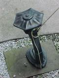 cast metal garden sculpture and lamp